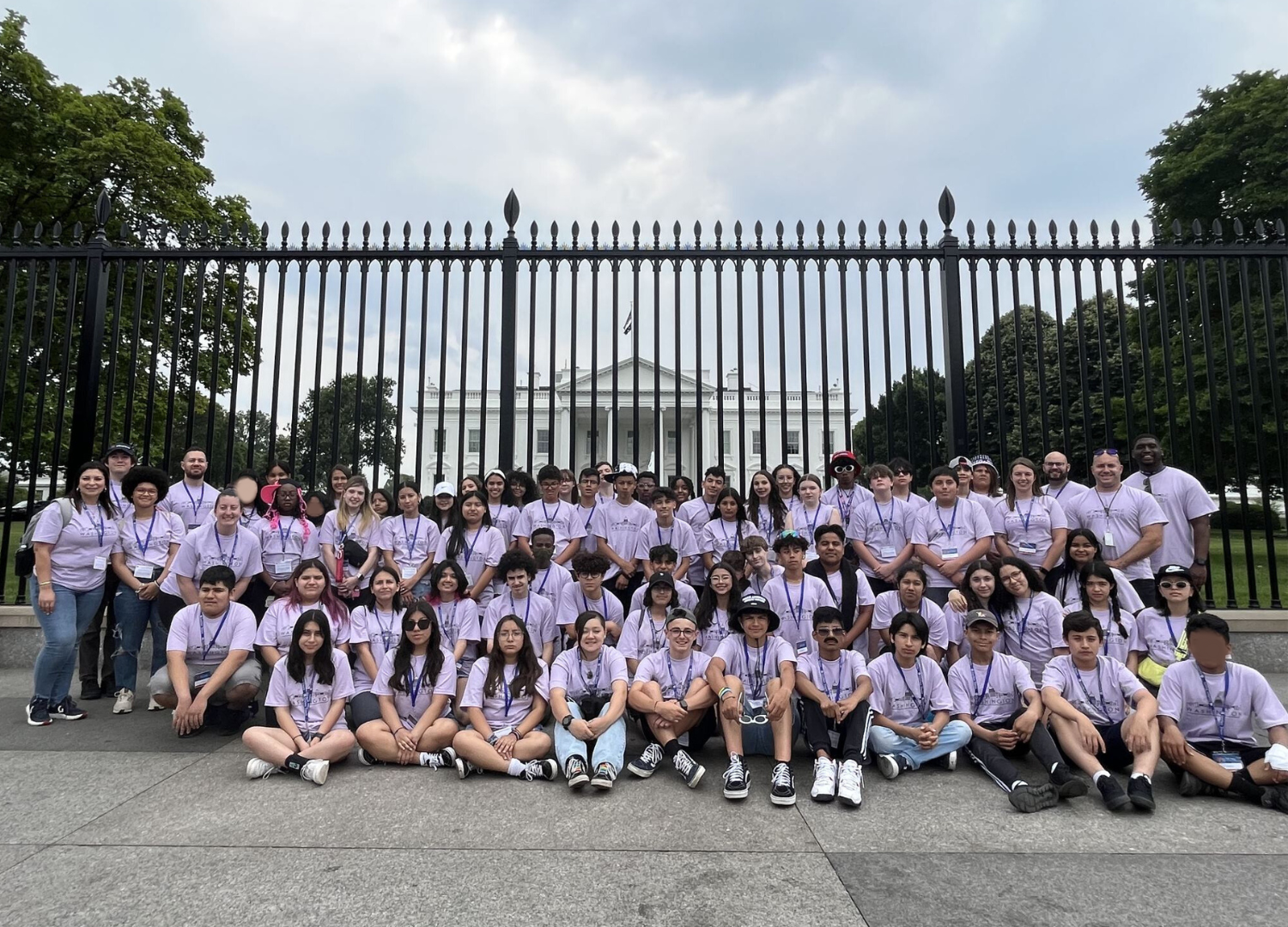 The students and chaperones pose for a photo in front of the White House.