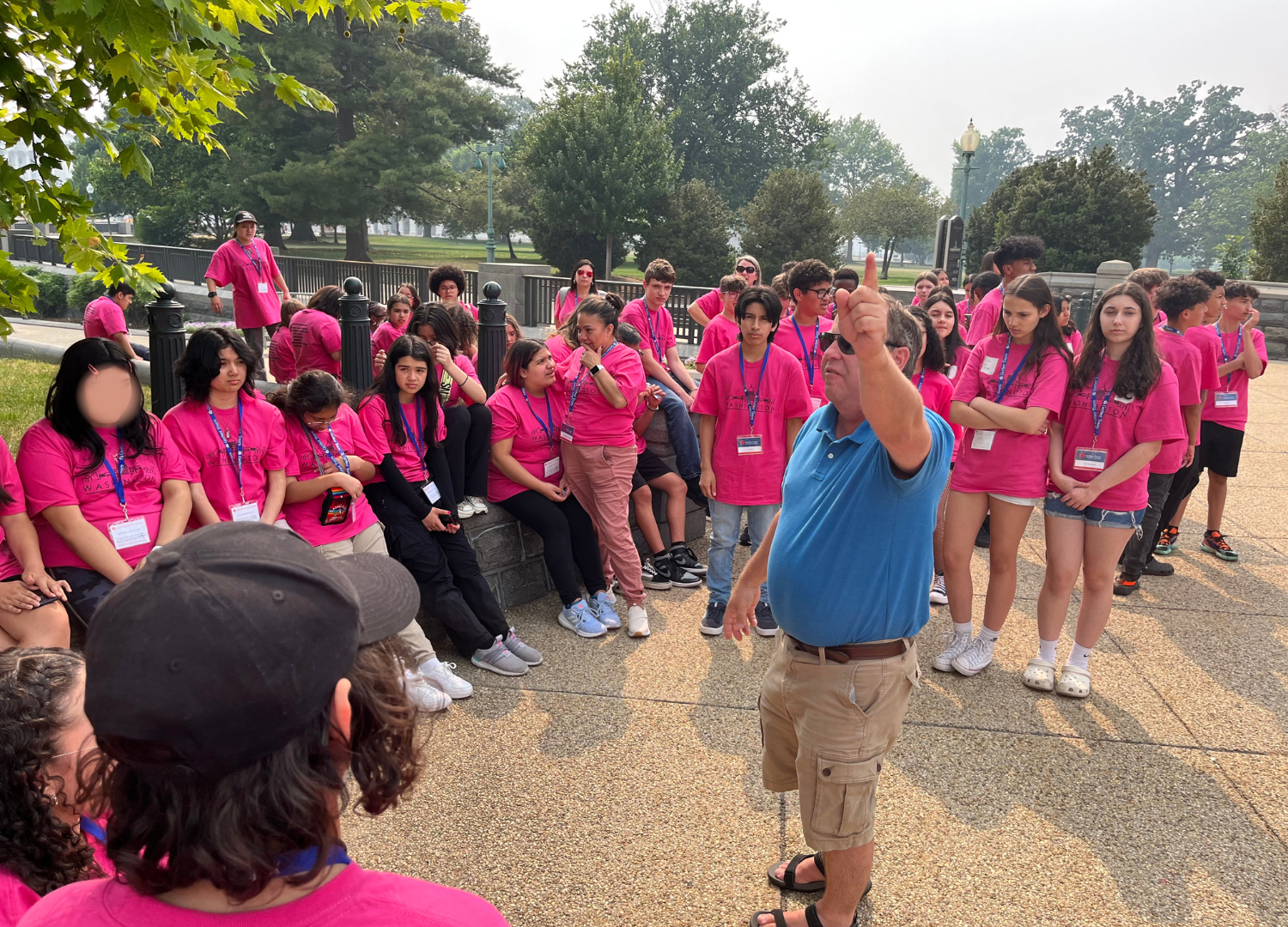 Tour guide stops the group to point out some iconic sites in Washington D.C.