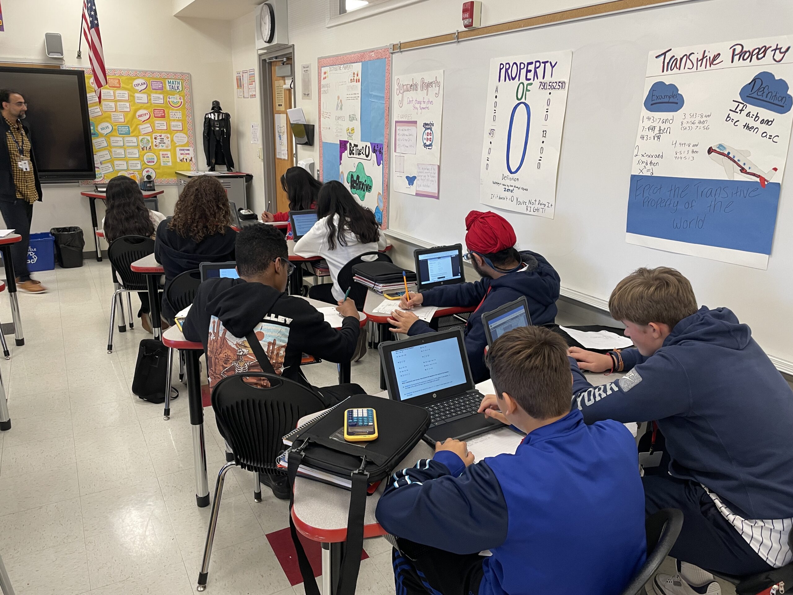 Students work at their desks using the new Chromebooks during math class at Community Middle School..